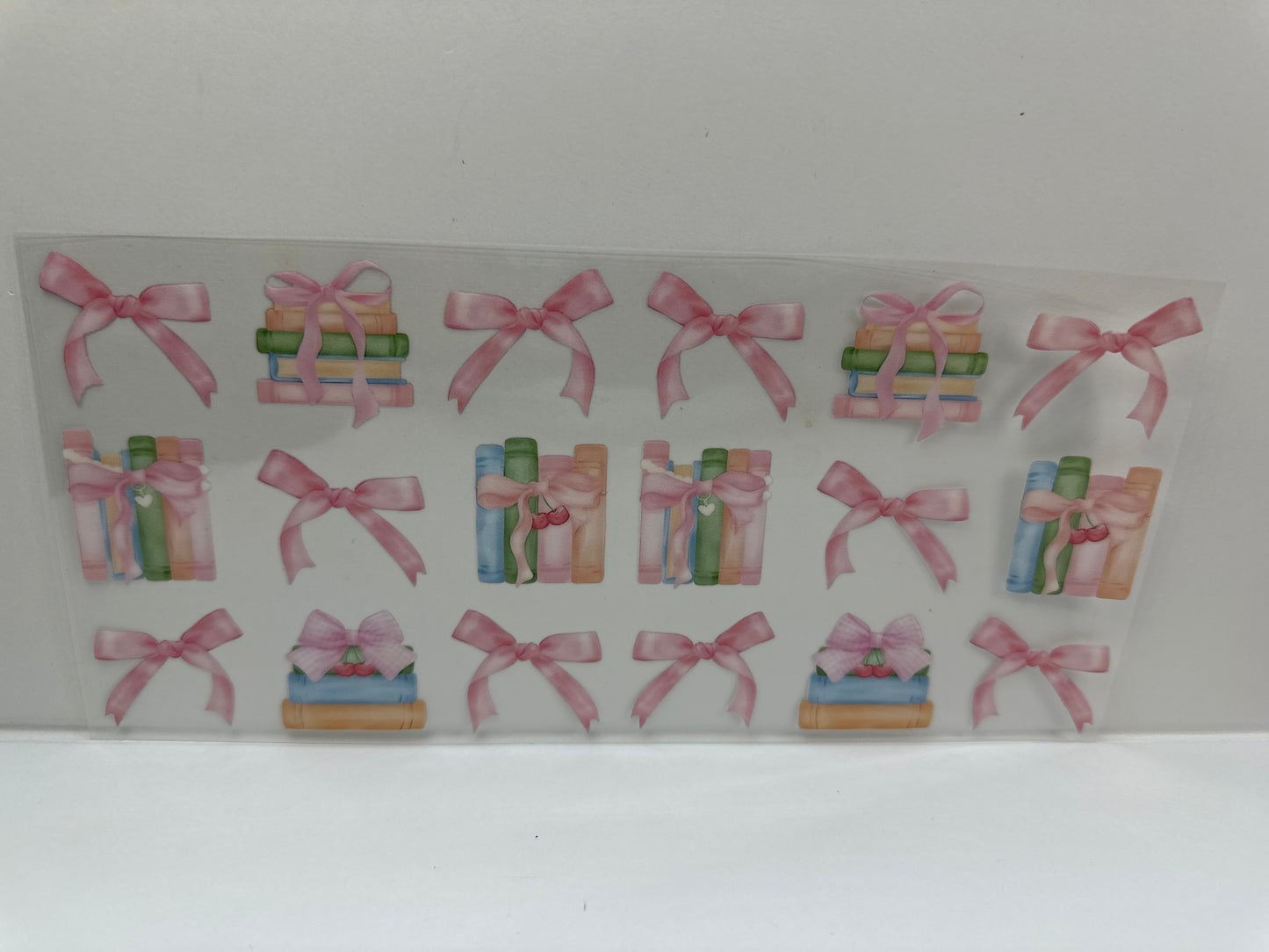 G442 books with pink bows , book club