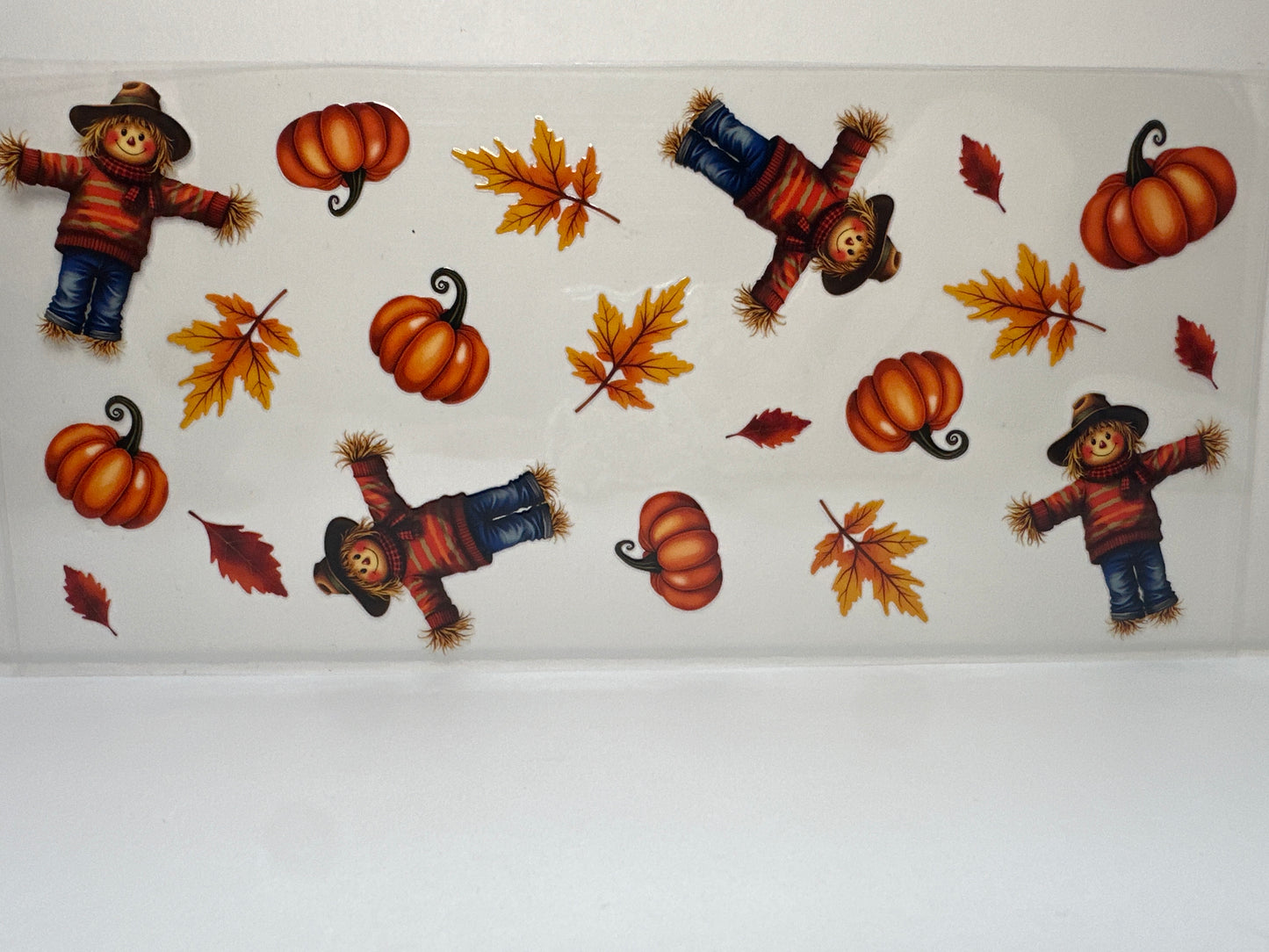 F384 Fall time pumpkin leaves and scarecrows