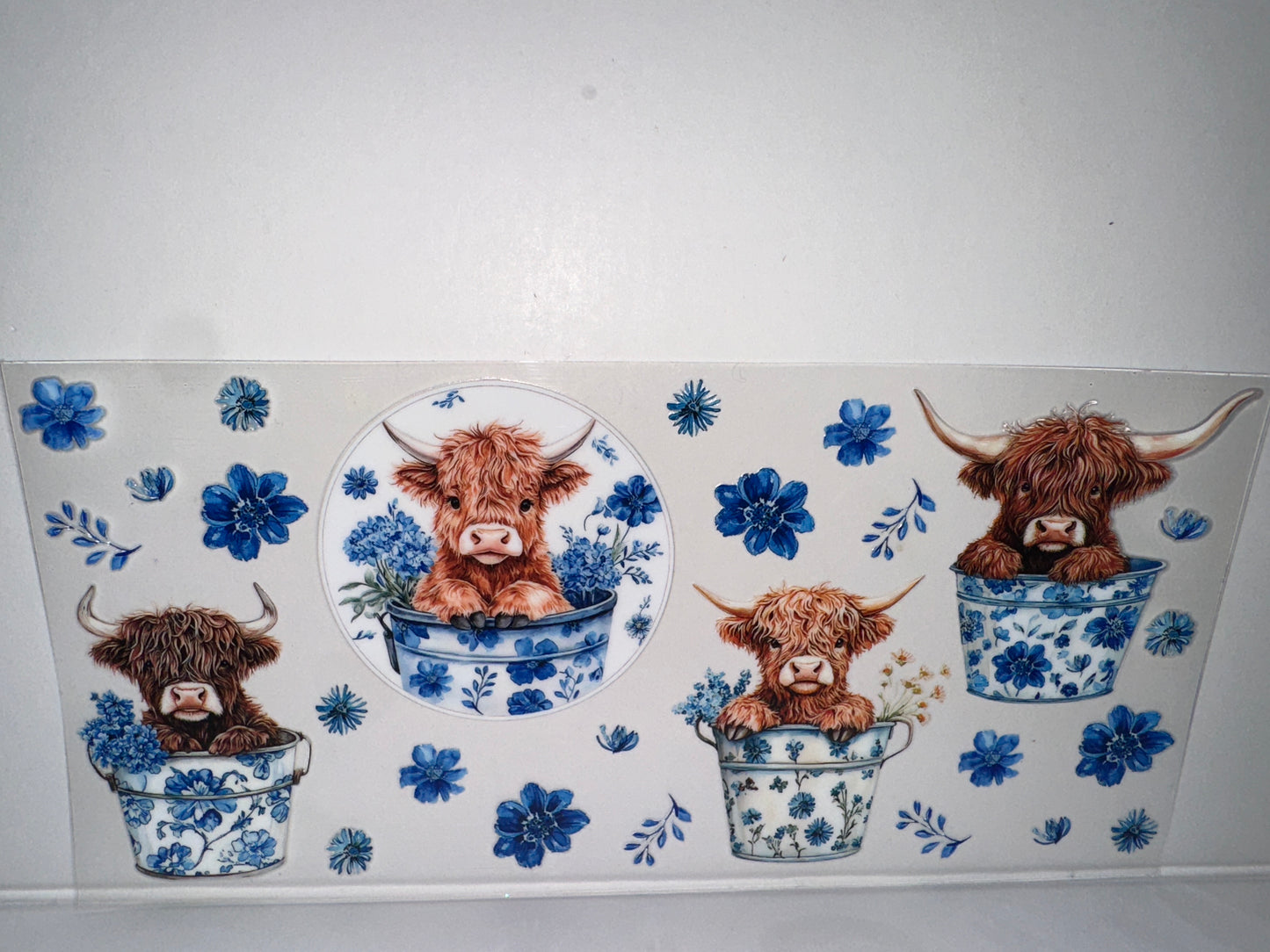 H141 cow with blue flowers