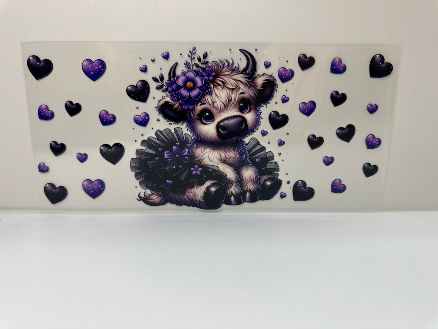 F447 cow with black tutu and black and purple hearts