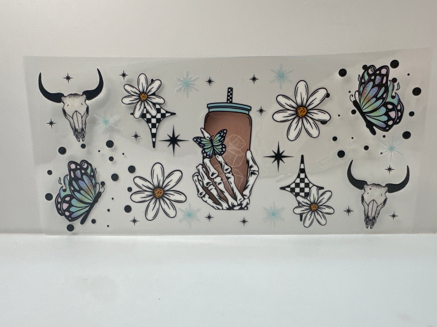 F853 skull hands with coffee