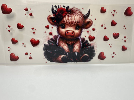 F442 cow with black tattoo and red hearts