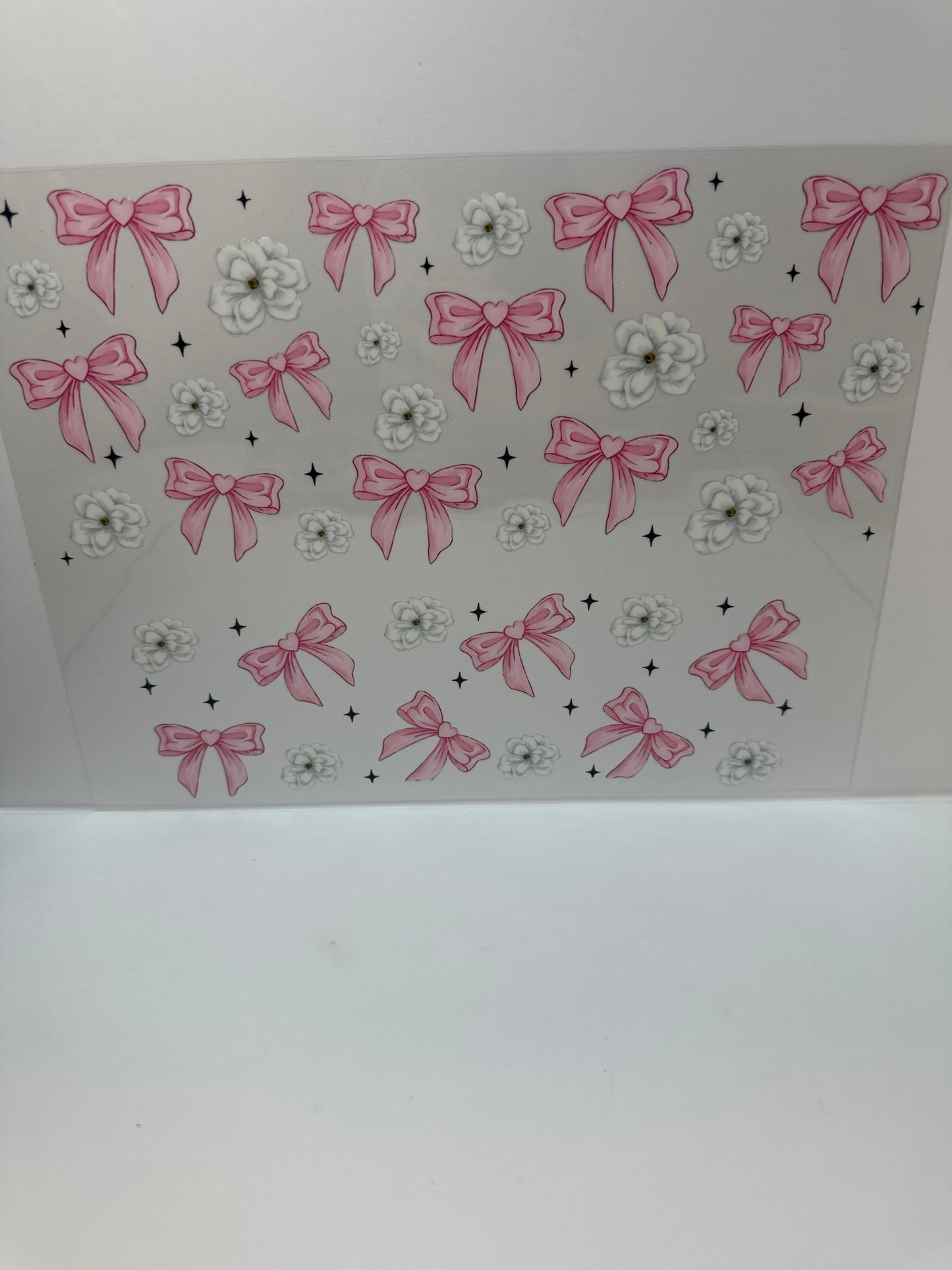 F782 pink bows with white flowers and black stars 40 ounce cup wrap
