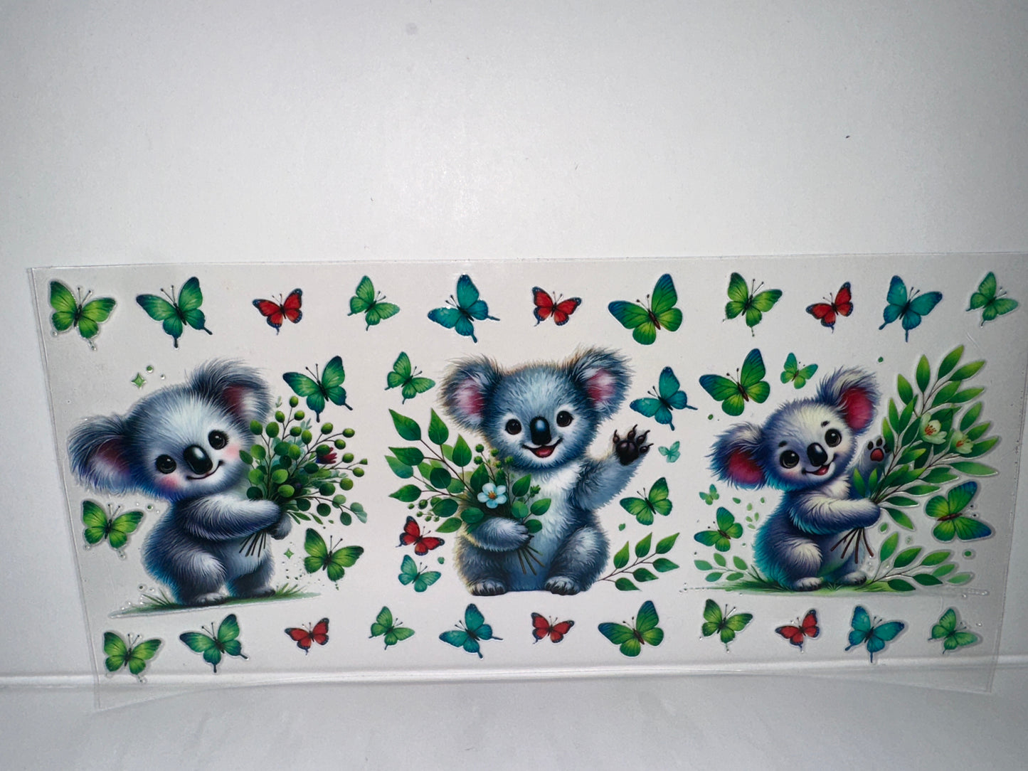 H144 koala bear with butterflies