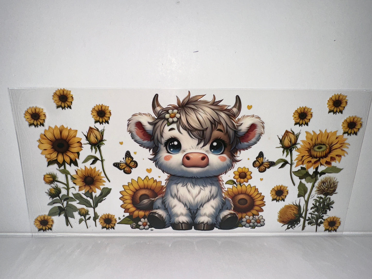 H450 Cow with sunflowers and butterflies