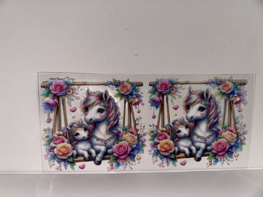 H577  unicorn on swing