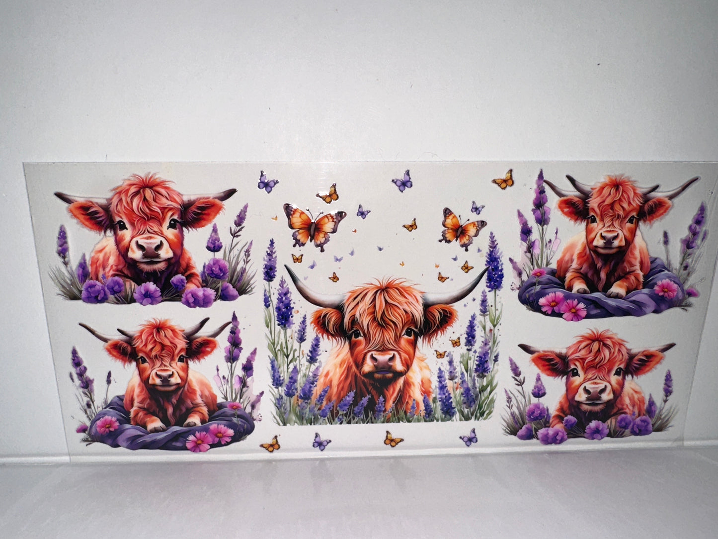 H140 cow with butterflies and purple flowers