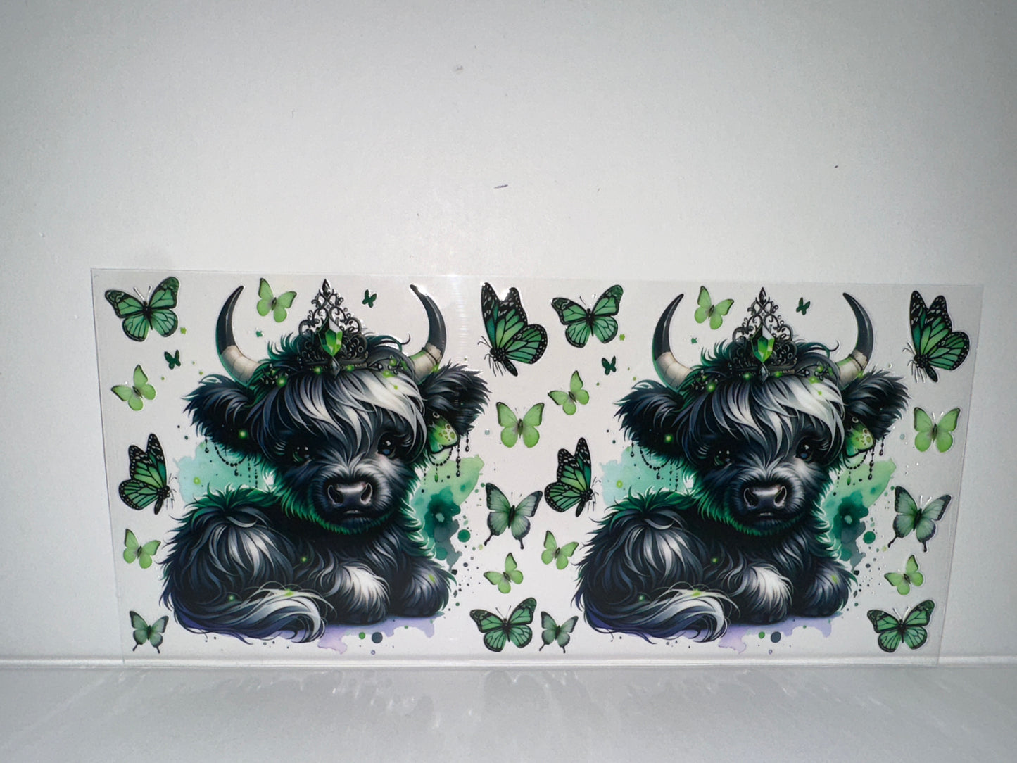 H465 cow with green butterflies