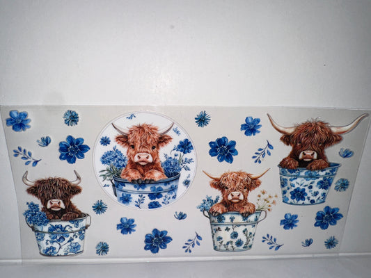 H141 cow with blue flowers
