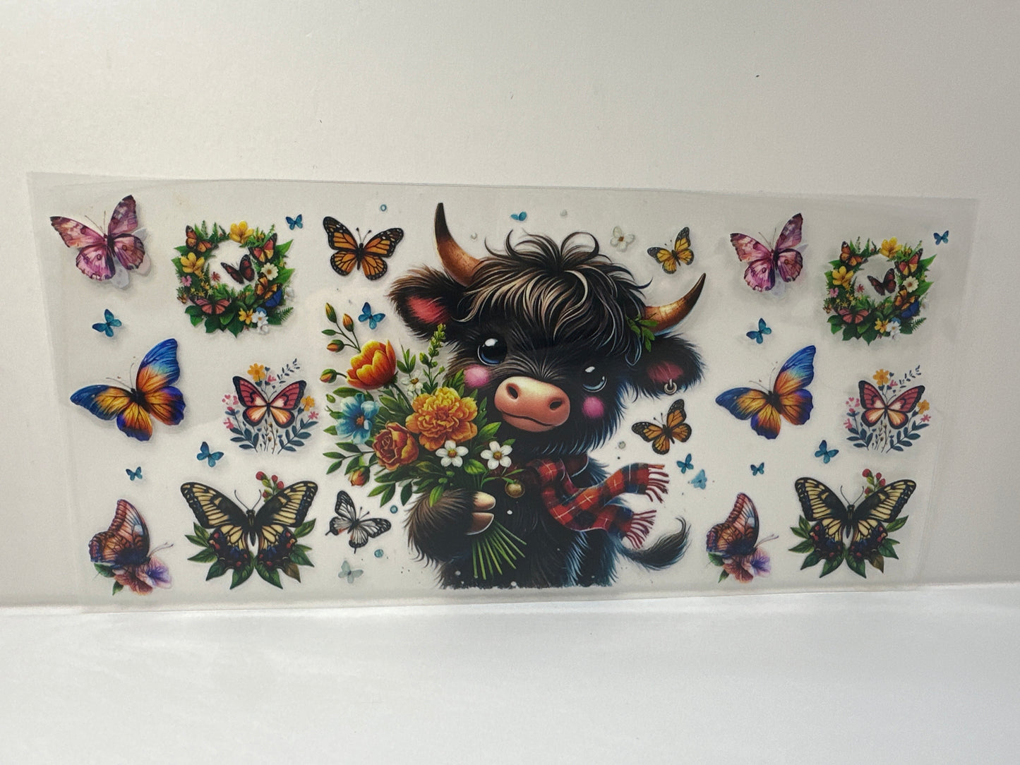 G491 black cow with butterflies and flowers