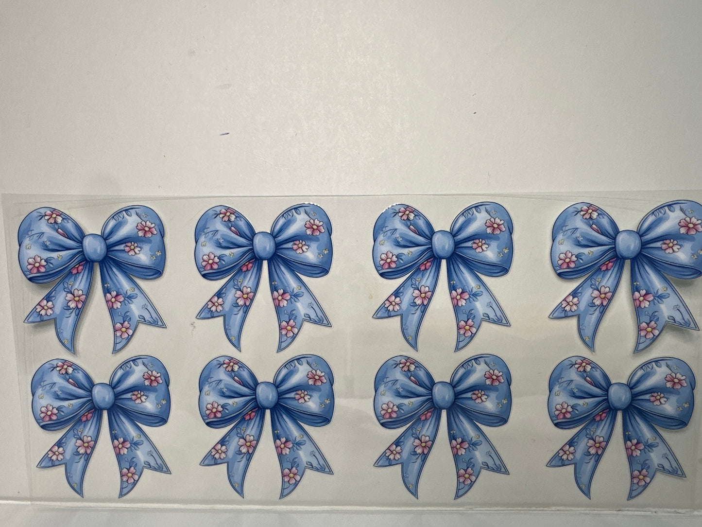 H1262 Blue bows with pink flowers