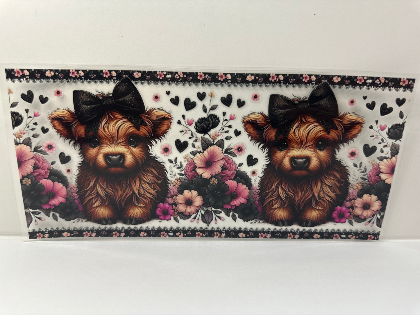 G507 cow with flowers and black bow