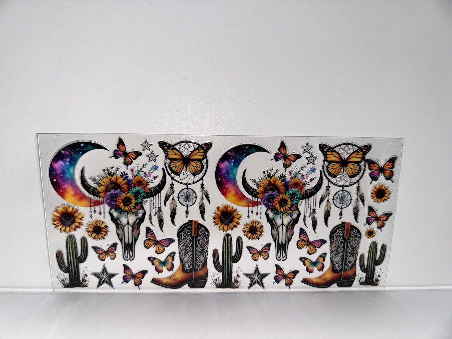 H25 skulls, moons, butterflies, boots, and sunflowers western