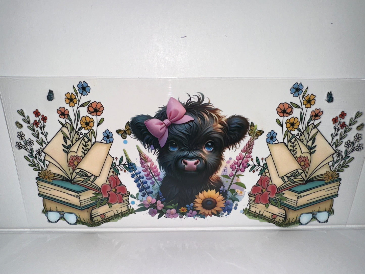 H449 Cow with books and flowers