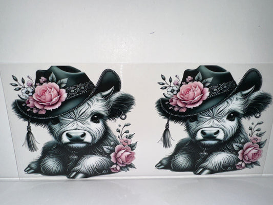H448 Cow with black hat and pink flowers