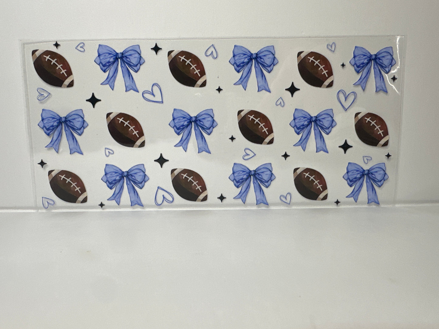 E352 footballs with blue hearts and bows