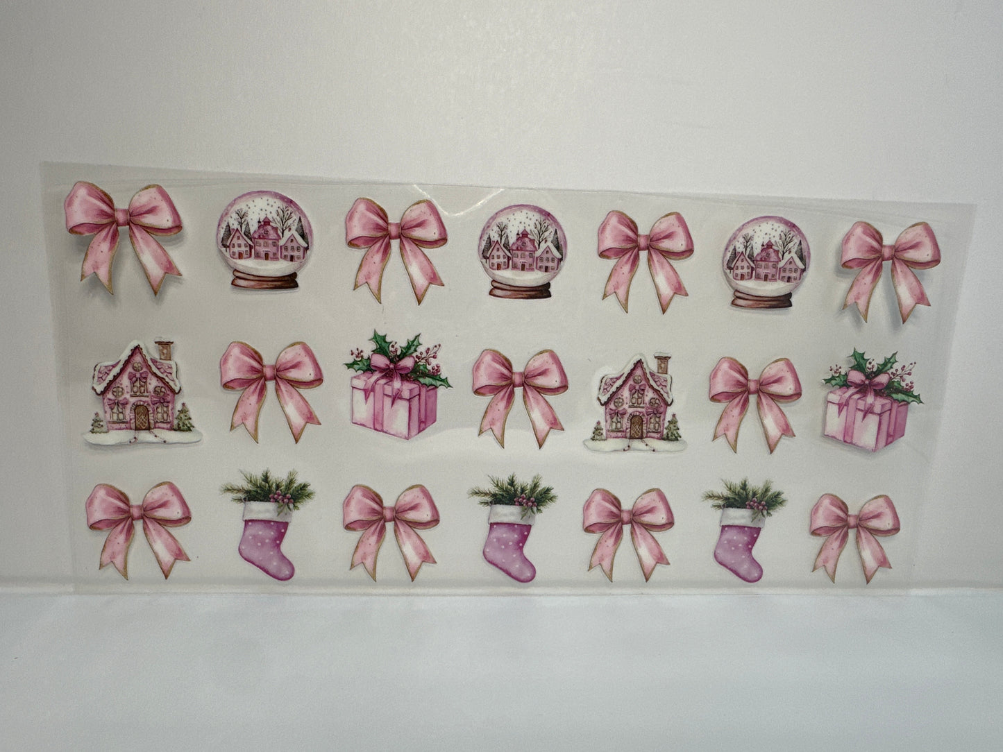 G225 pink Christmas snow globes with bows