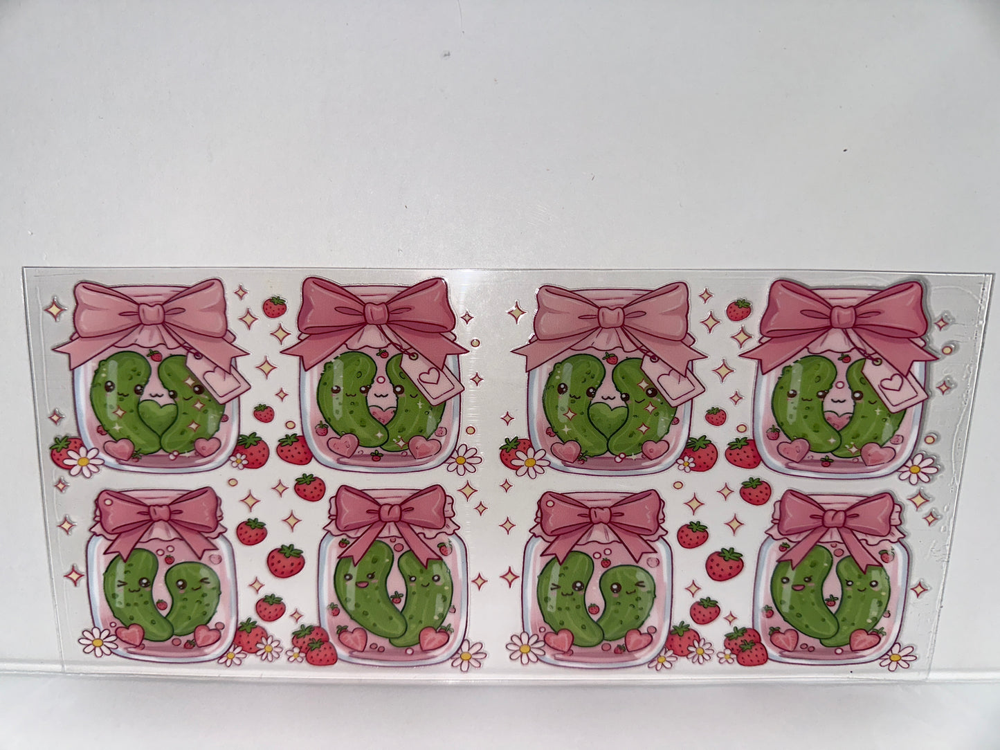 H234 pickles in a jar with bows and strawberries
