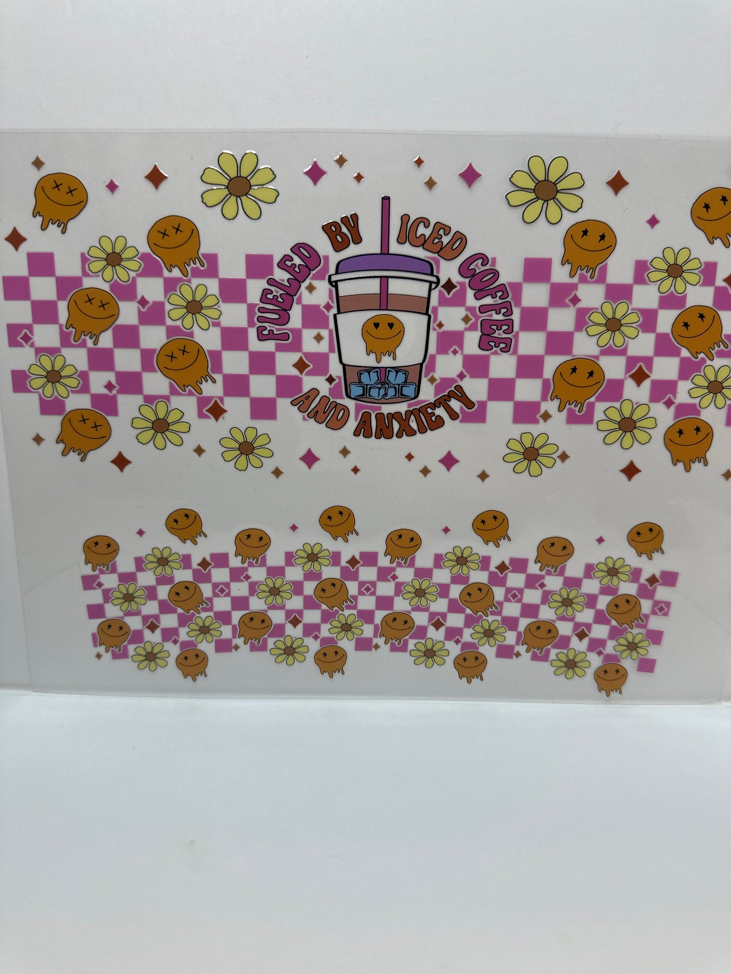 F770 checkered face and flowers viewed by iced coffee and anxiety, 40 ounce cup wrap