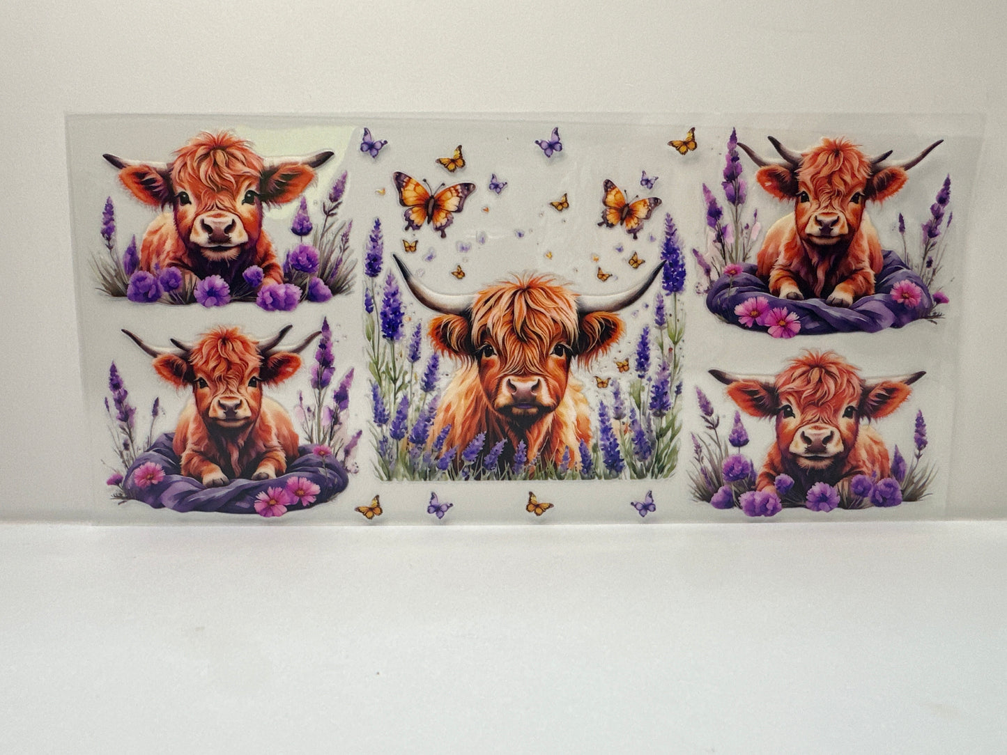 F828 highland cow with flowers and butterflies